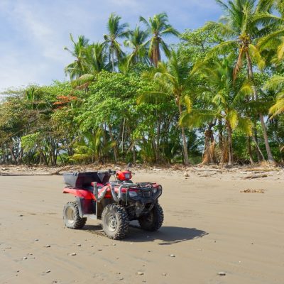 All-terrain,Quad,Bike,Standing,On,The,Sandy,Beach,Of,Costa